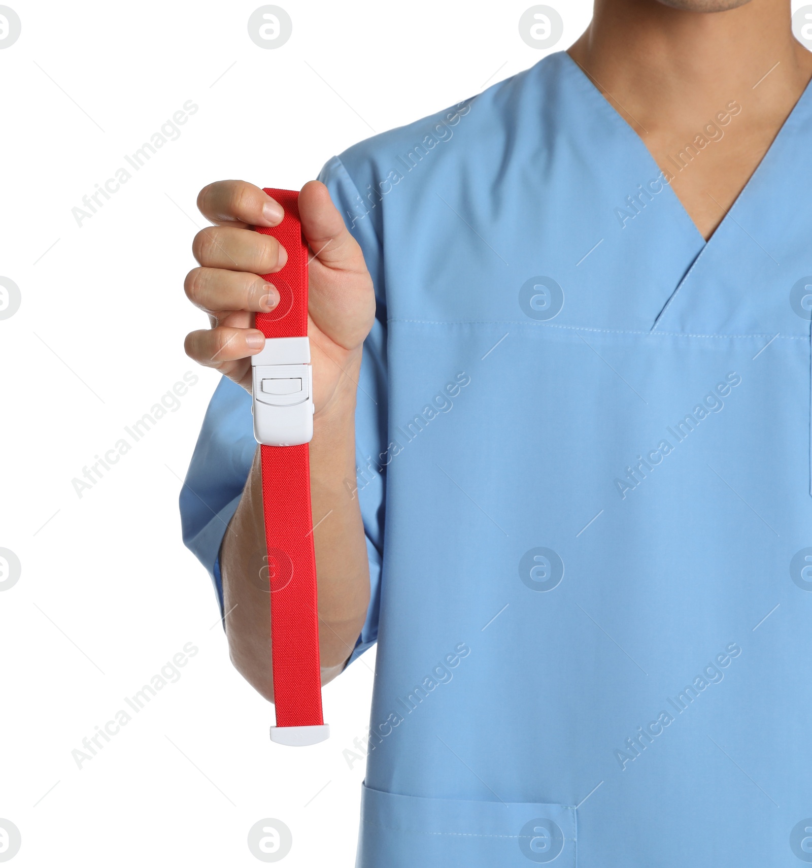 Photo of Male doctor holding tourniquet on white background, closeup. Medical object