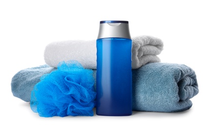 Photo of Personal hygiene product with towels and shower puff on white background