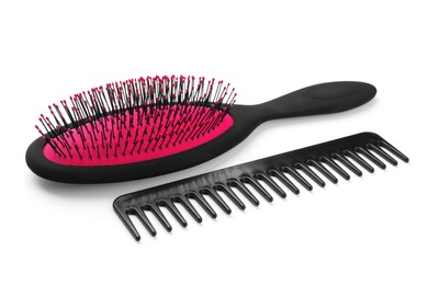 Photo of Plastic hair brush and comb isolated on white