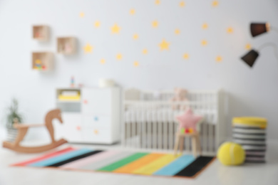 Blurred view of stylish baby room interior