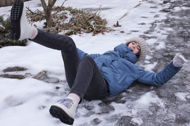 Photo of Young woman fell after slipping on icy road