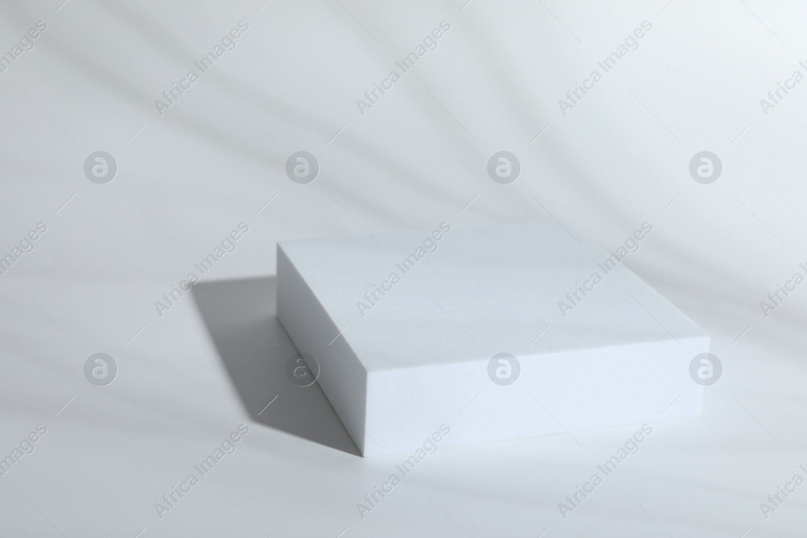 Photo of Presentation of product. Podium on white background, space for text