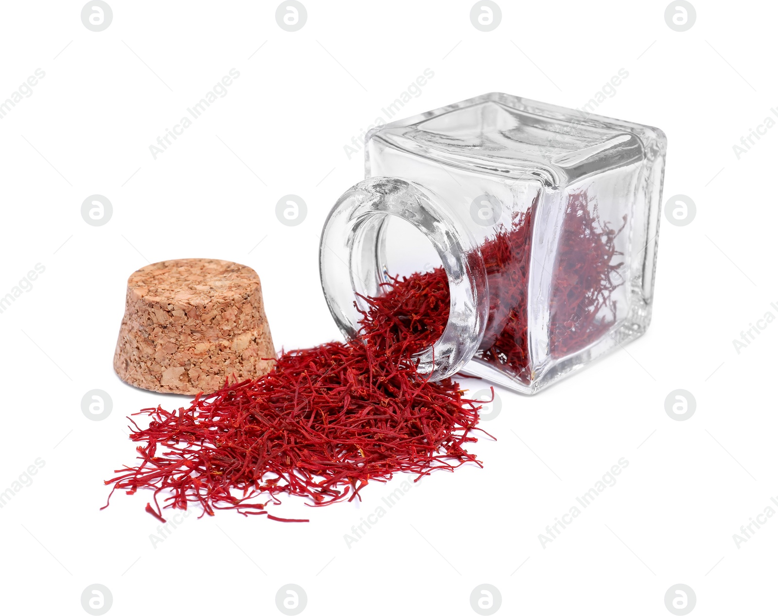 Photo of Aromatic saffron and glass jar isolated on white