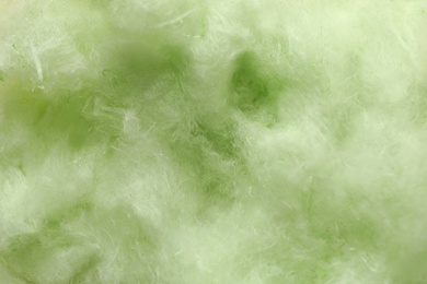 Photo of Fluffy yummy cotton candy as background, closeup