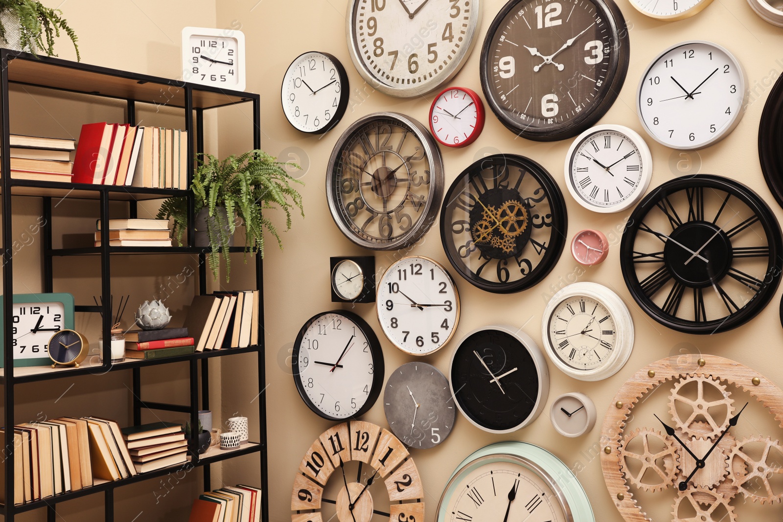 Photo of Stylish room interior with collection of wall clocks