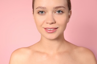 Portrait of beautiful young woman on color background. Lips contouring, skin care and cosmetic surgery concept