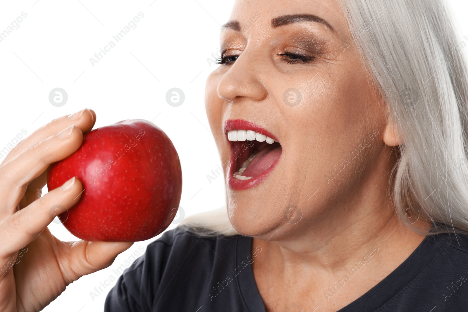 Photo of Smiling woman with perfect teeth and red apple on white background, closeup