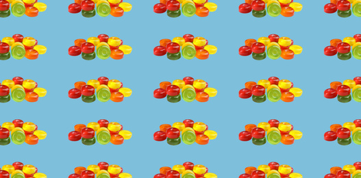 Collage with tasty candies on light blue background, pattern design