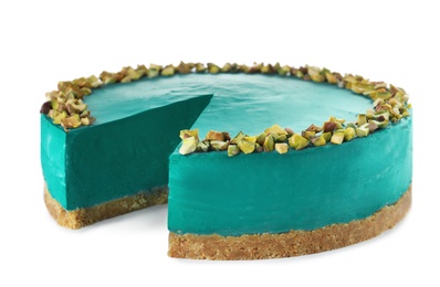 Delicious spirulina cheesecake decorated with pistachios isolated on white