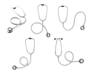 Image of Set with stethoscopes on white background 