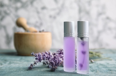 Composition with lavender flowers and natural cosmetic on table