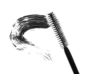 Photo of Smear of black mascara and applicator isolated on white, top view