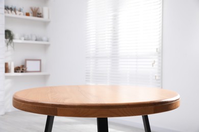 Photo of Empty wooden table indoors, closeup. Stylish furniture