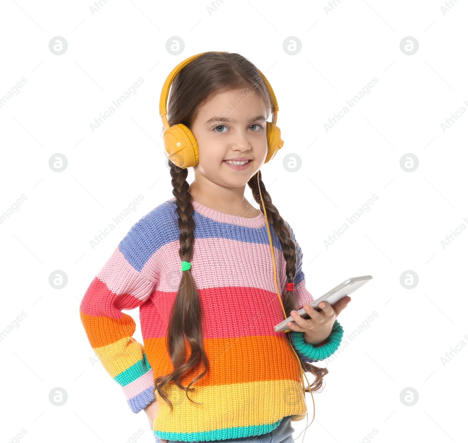 Photo of Cute little child with headphones and mobile phone on white background