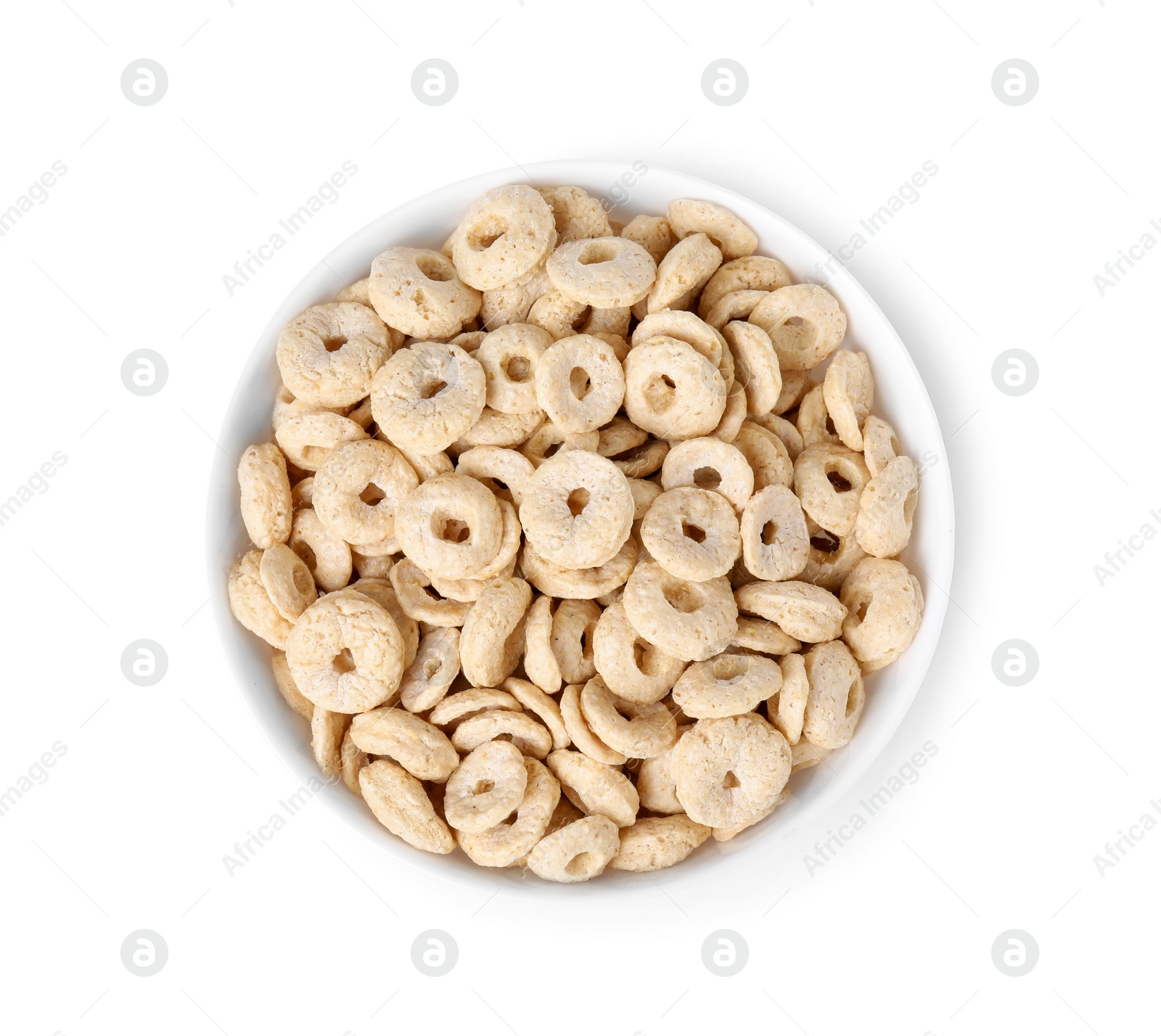 Photo of Tasty cereal rings in bowl isolated on white, top view