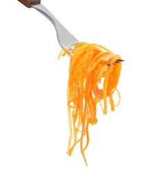 Photo of Fork with delicious Korean carrot salad on white background