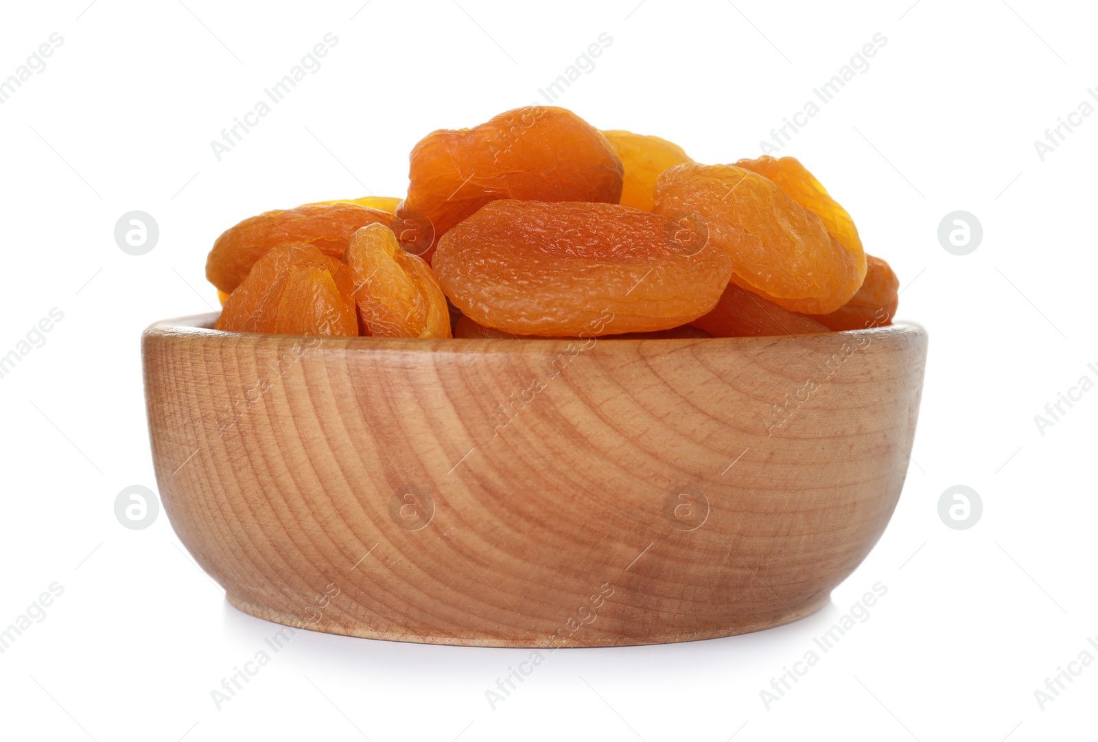Photo of Bowl with apricots on white background. Dried fruit as healthy food