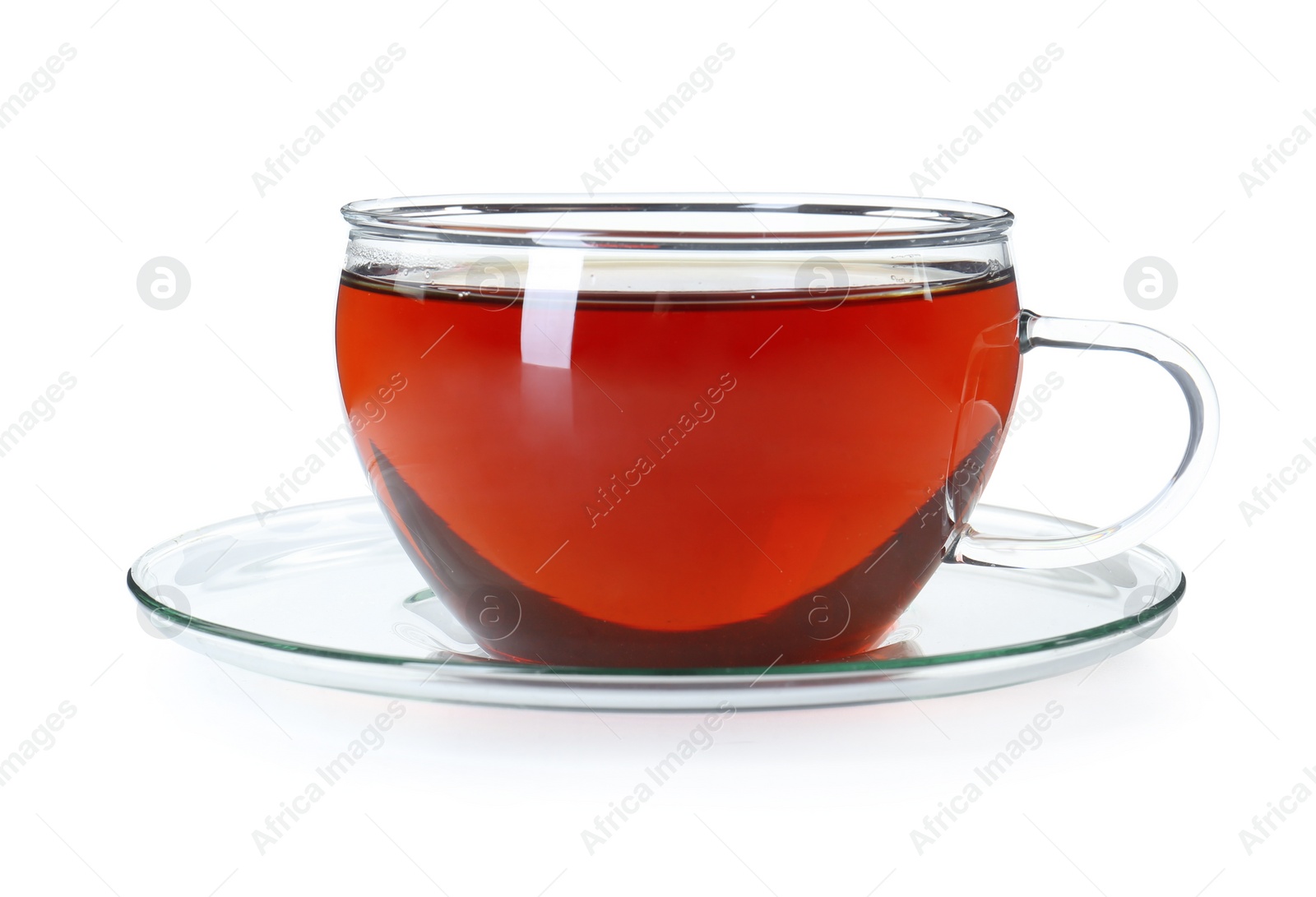 Photo of Aromatic tea in glass cup isolated on white