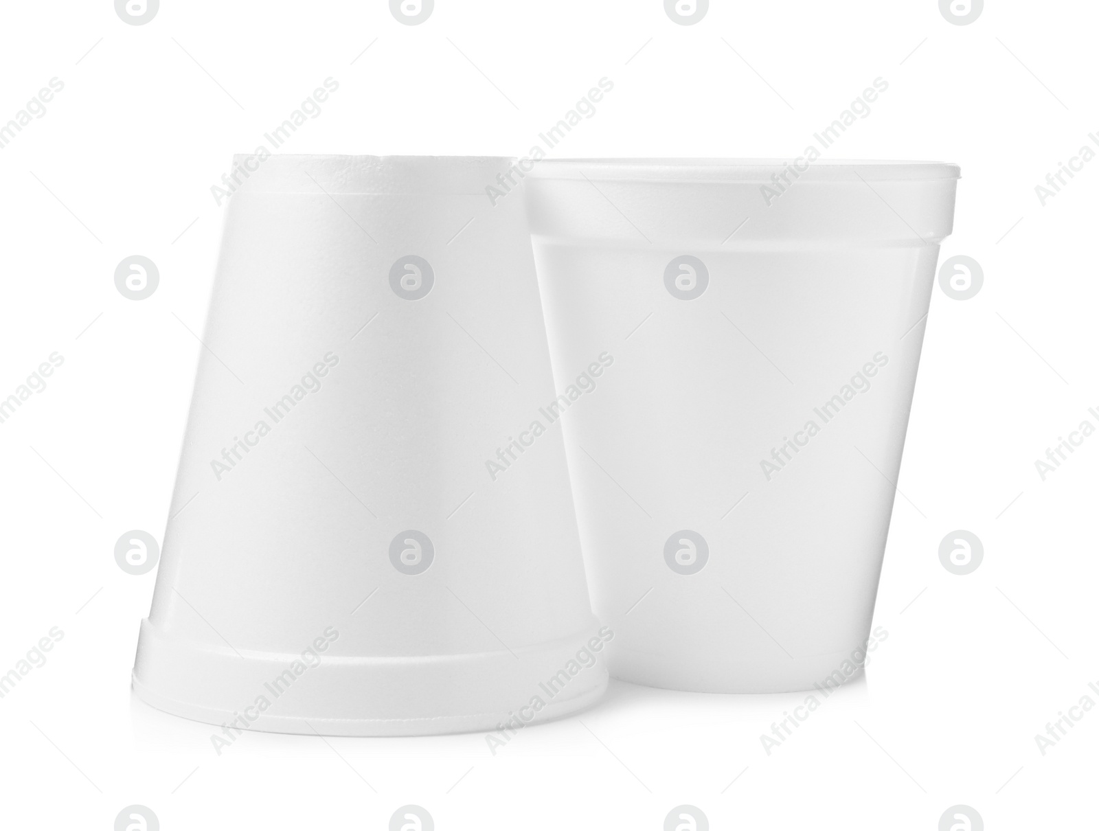 Photo of Two clean styrofoam cups on white background