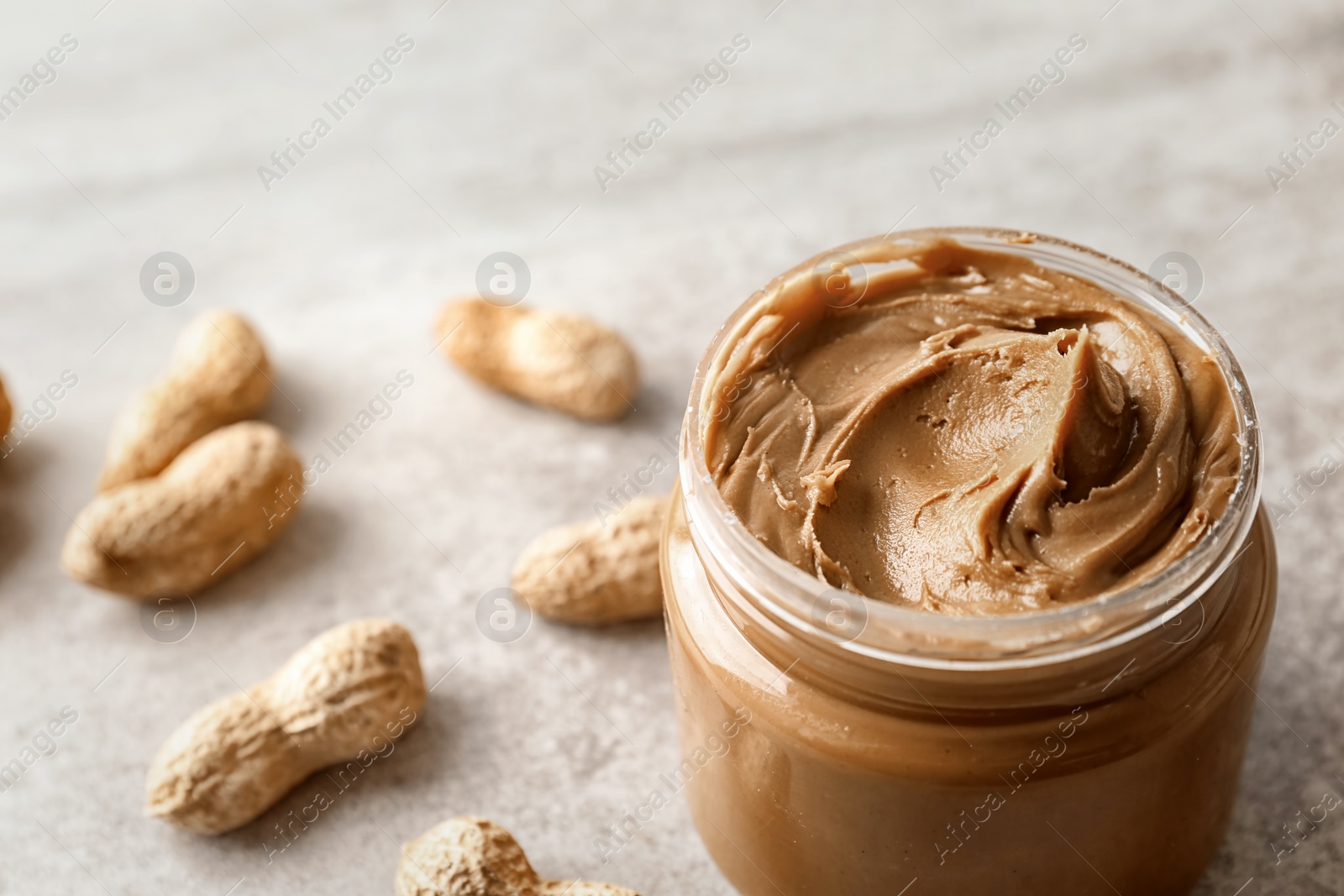 Photo of Jar with creamy peanut butter, closeup