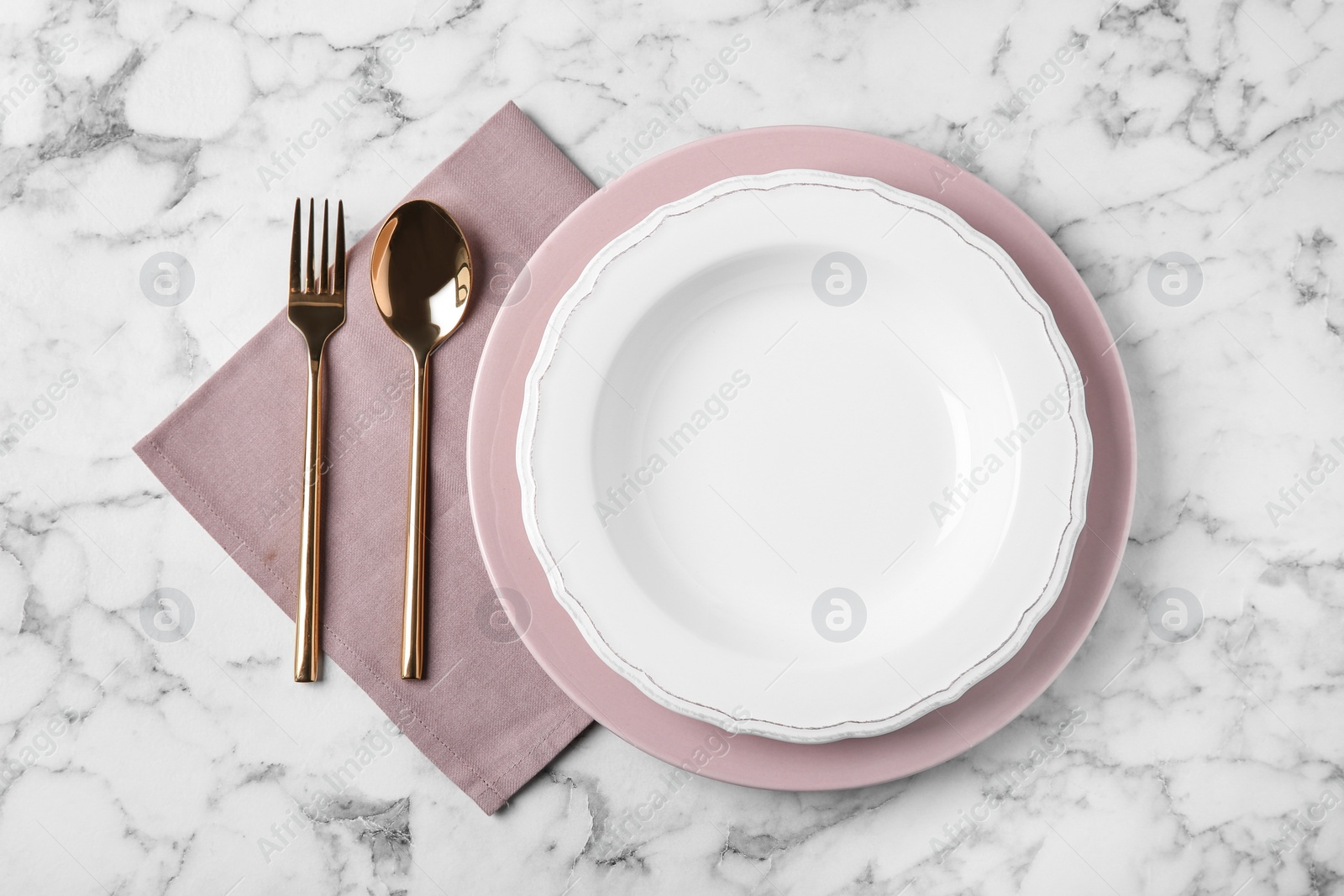 Photo of Beautiful table setting on white marble background, flat lay