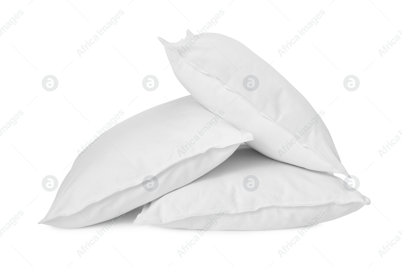 Photo of Three new soft pillows isolated on white