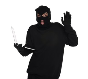 Emotional thief in balaclava with laptop raising hand on white background