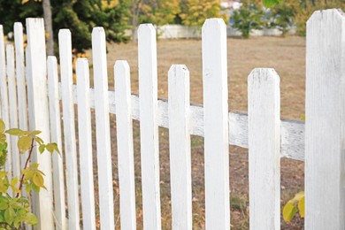 Photo of Beautiful white wooden fence outdoors on sunny day