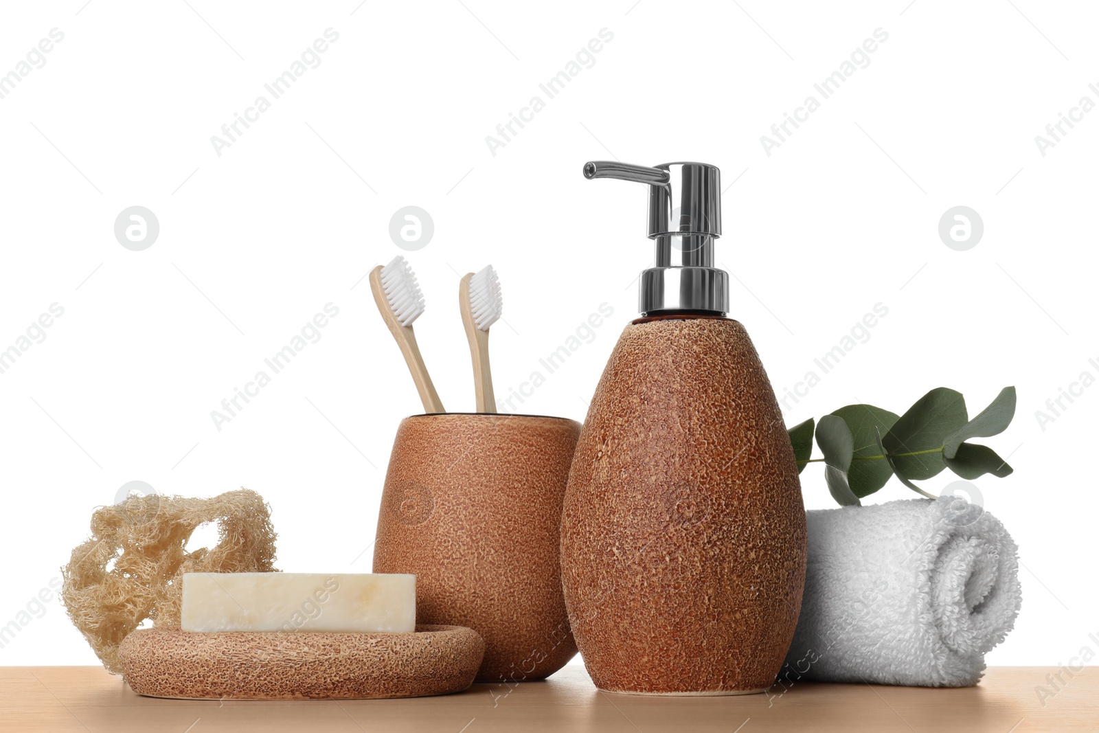 Photo of Bath accessories. Different personal care products and eucalyptus branch on wooden table against white background