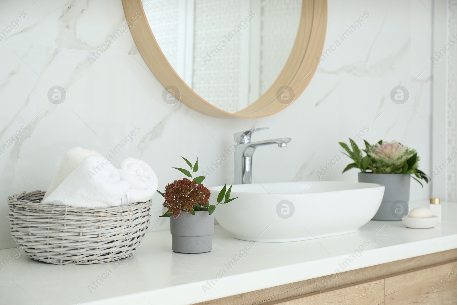 Photo of Modern bathroom interior with stylish mirror and vessel sink