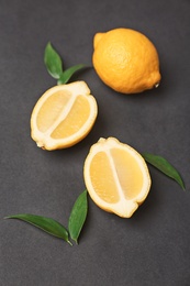 Photo of Fresh yummy lemons on dark background