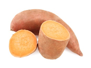 Photo of Whole and cut sweet potatoes on white background