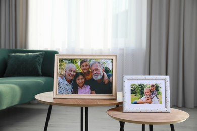 Framed family portraits in living room at home