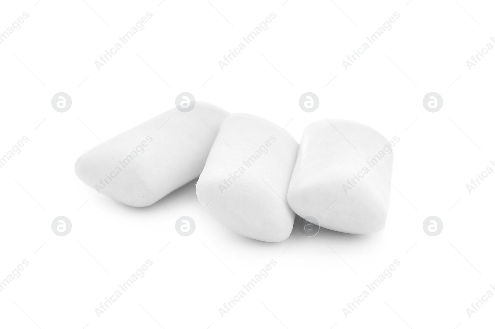 Photo of Three chewing gum pieces on white background