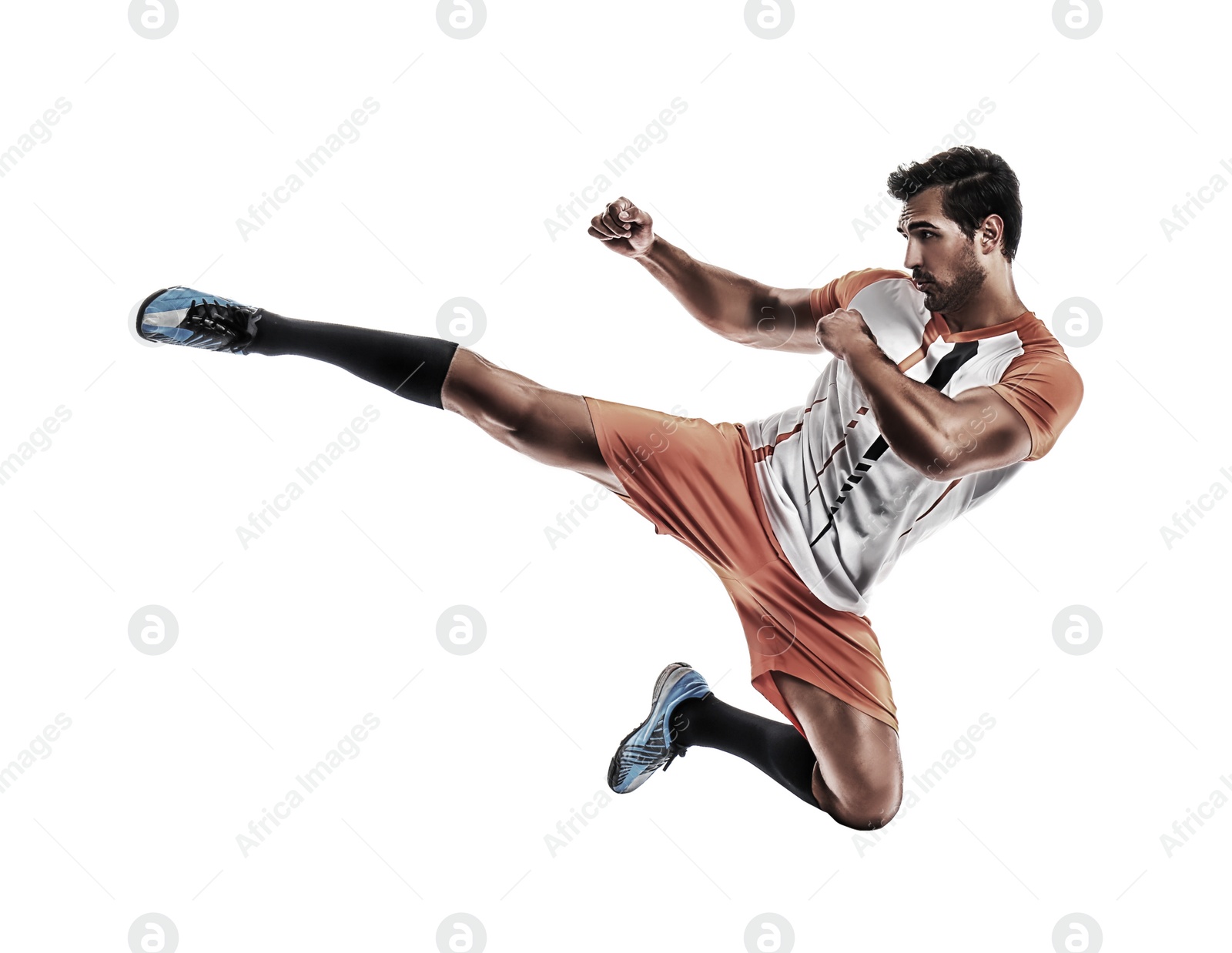 Image of Young man playing football on white background