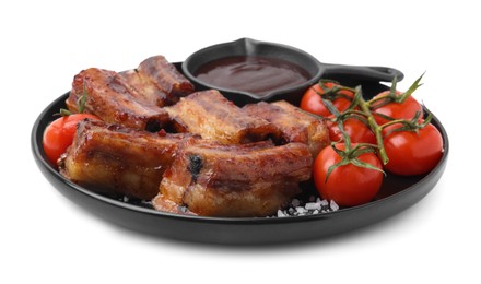 Photo of Tasty roasted pork ribs, sauce and tomatoes isolated on white