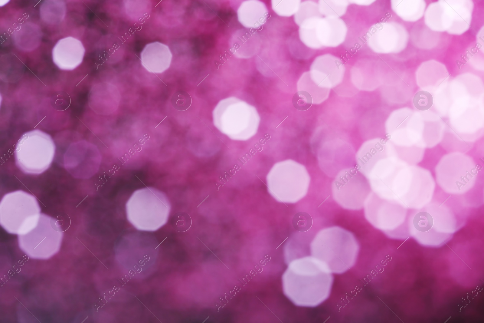 Photo of Bright magic pink bokeh effect as background