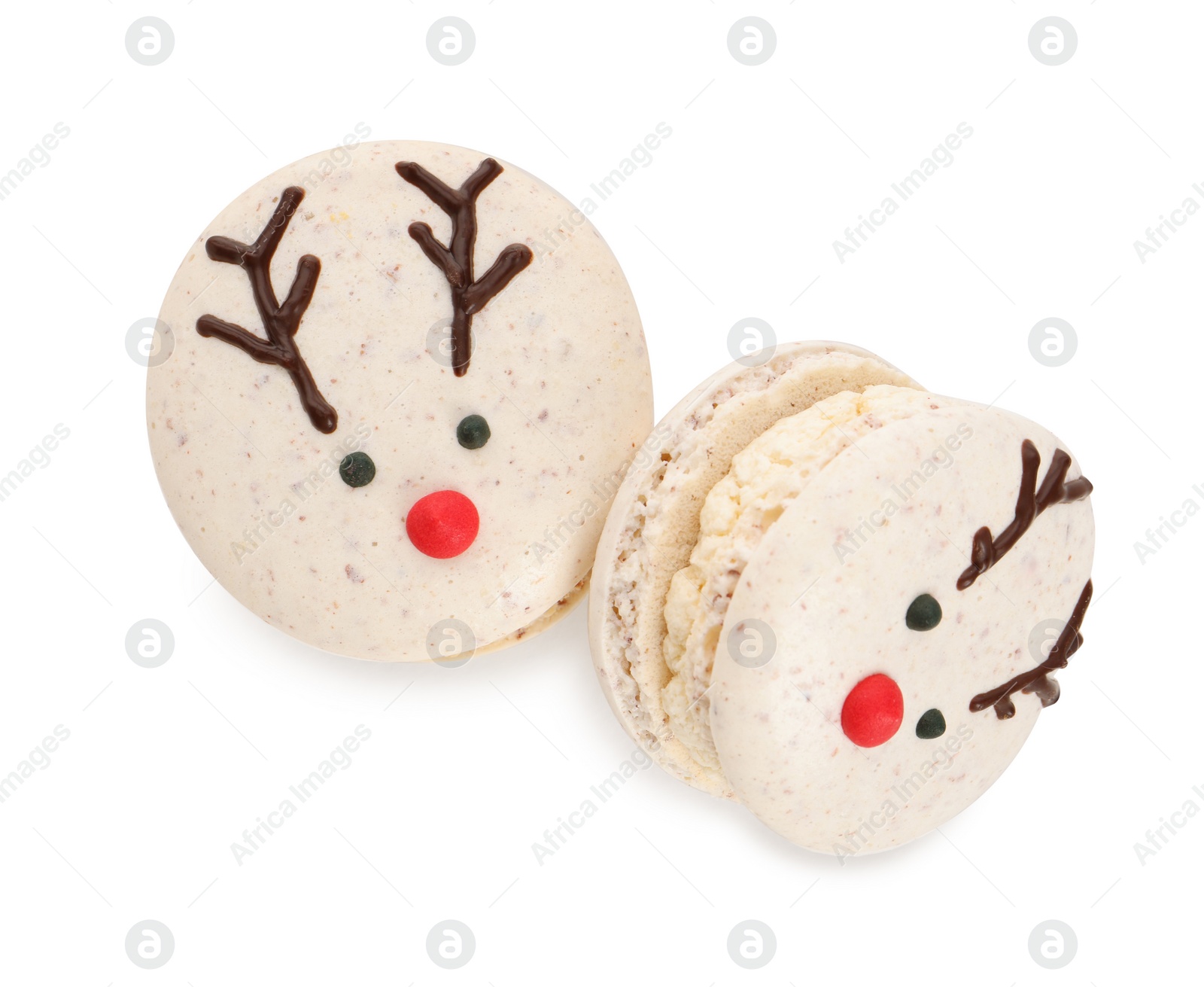 Photo of Tasty reindeer Christmas macarons on white background, top view