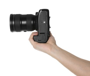 Photo of Photographer holding modern camera on white background, closeup