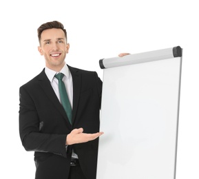 Young business trainer near flip chart on white background