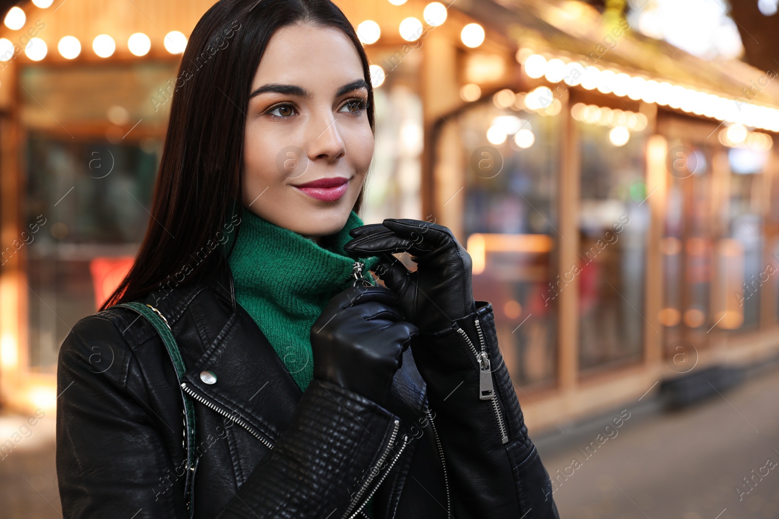 Photo of Portrait of beautiful young woman on city street. Autumn walk