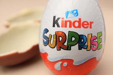 Photo of Slynchev Bryag, Bulgaria - May 25, 2023: Kinder Surprise Egg on blurred background, closeup