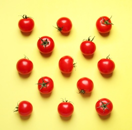 Photo of Flat lay composition with cherry tomatoes on color background