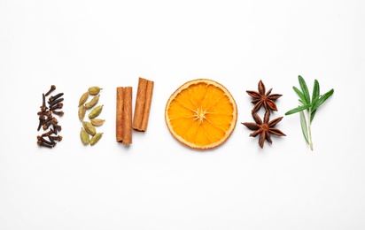Photo of Different mulled wine ingredients on white background, flat lay