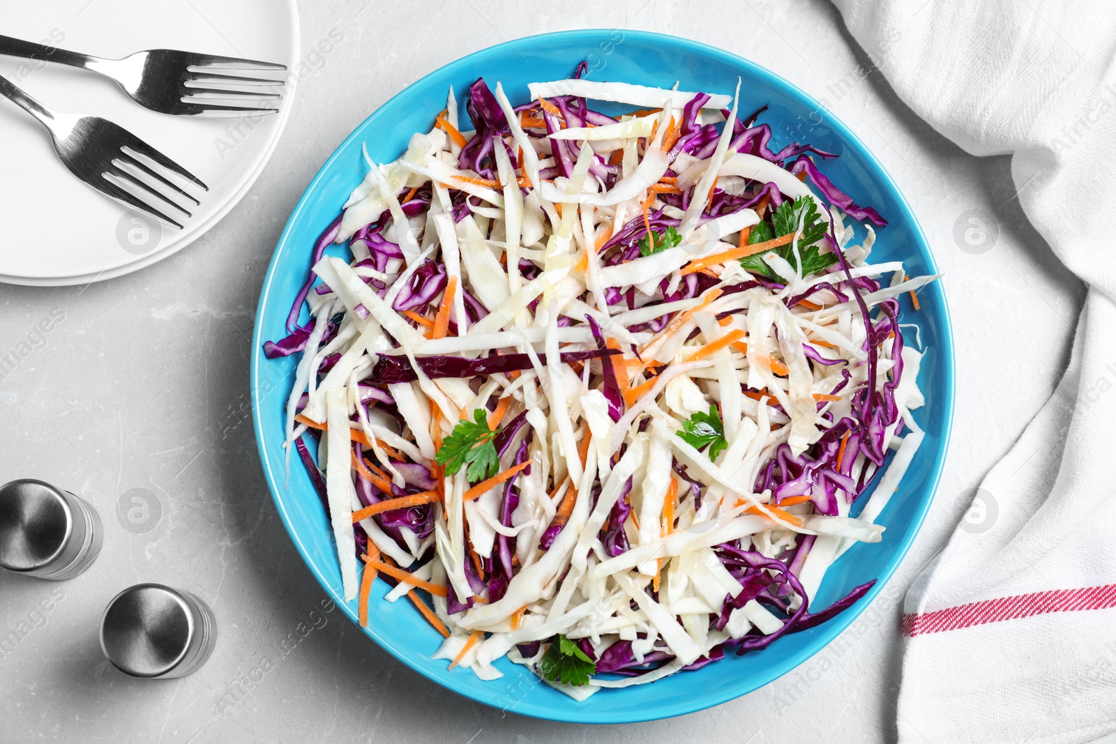 Photo of Flat lay composition with cabbage salad on light grey marble table