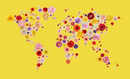 Image of World map made of beautiful flowers on yellow background, banner design