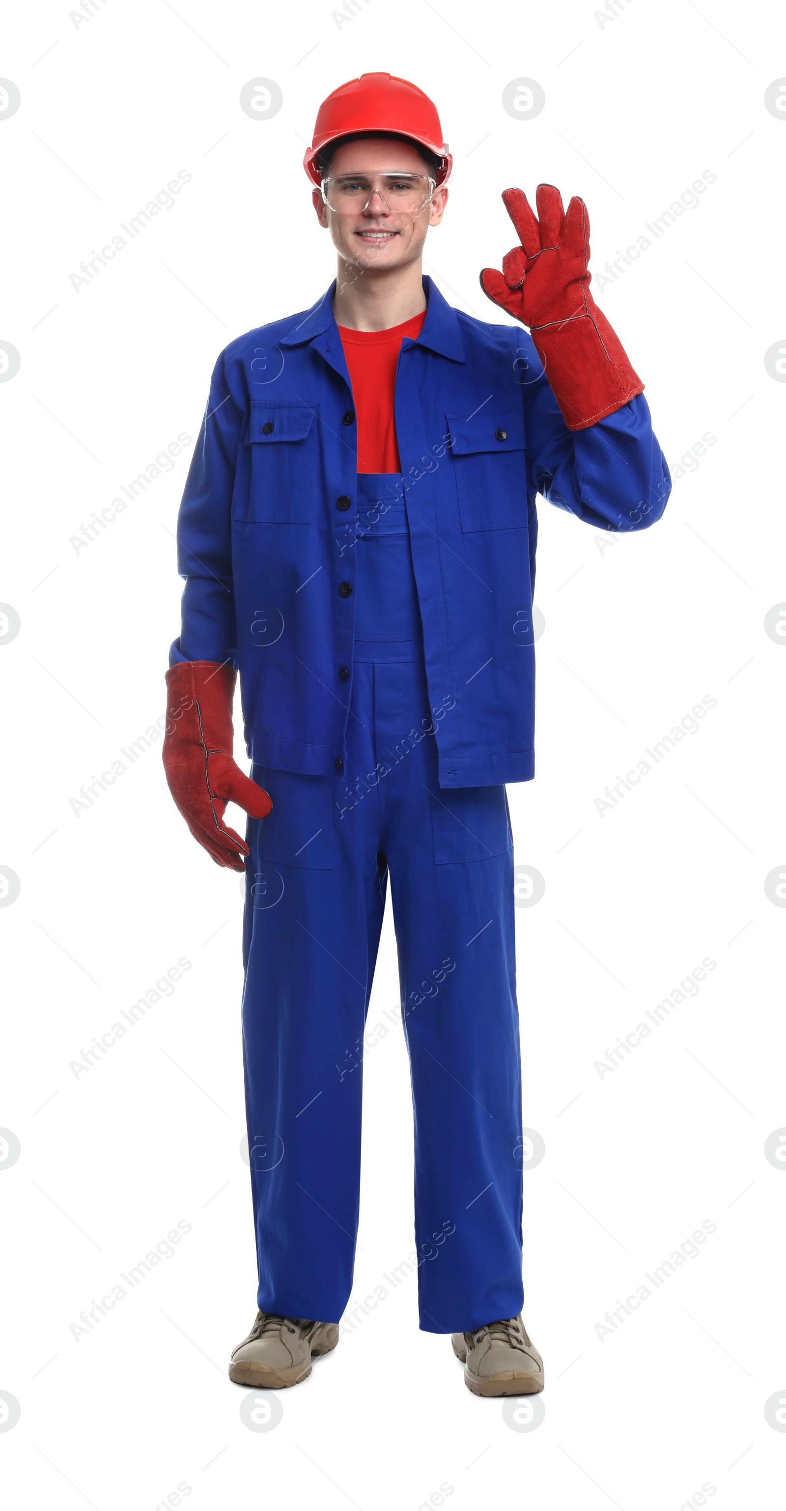 Photo of Young man wearing safety equipment and showing ok gesture on white background