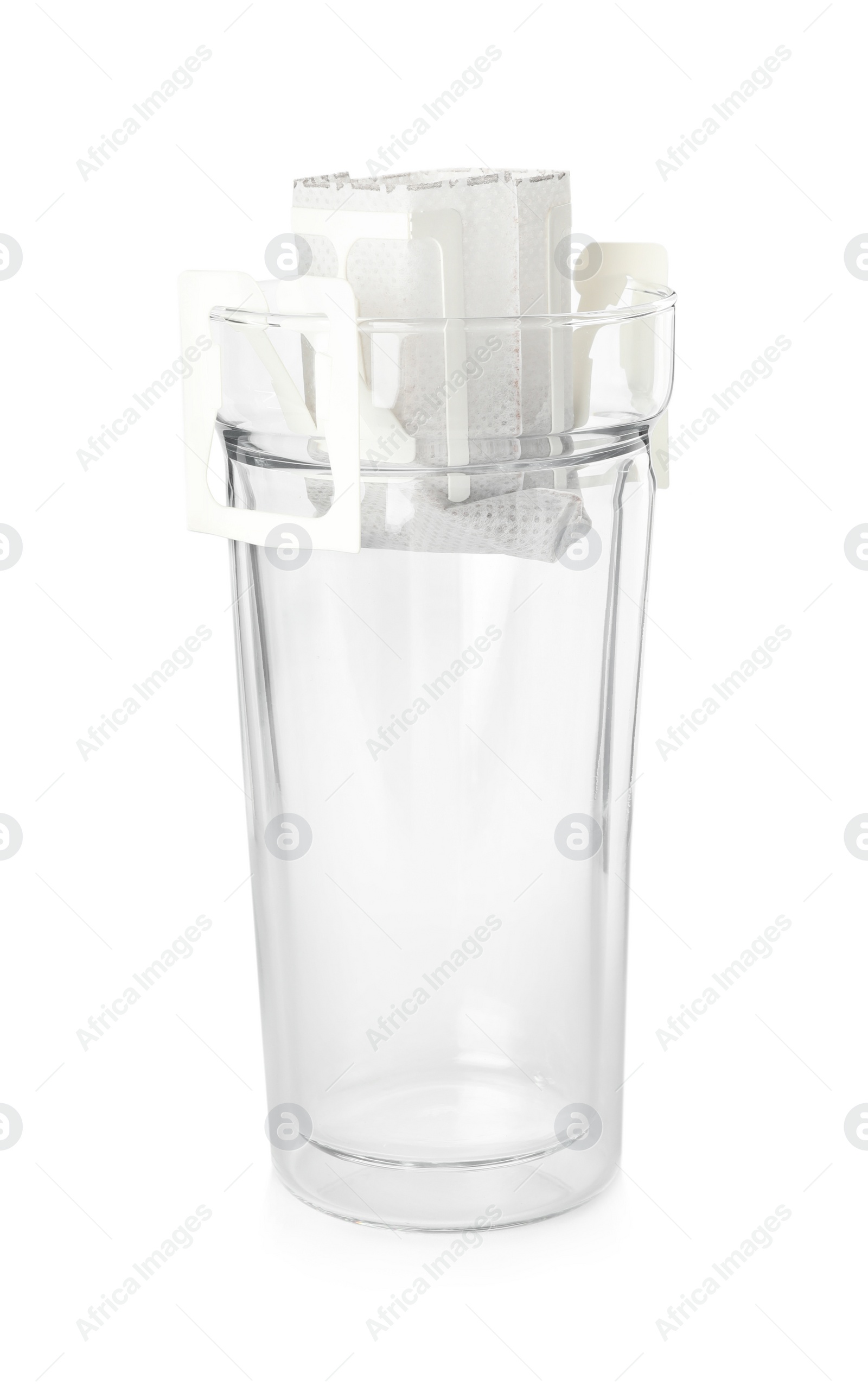 Photo of Glass with drip coffee bag isolated on white
