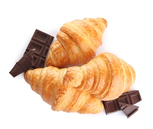 Photo of Tasty croissants with chocolate on white background, top view. French pastry
