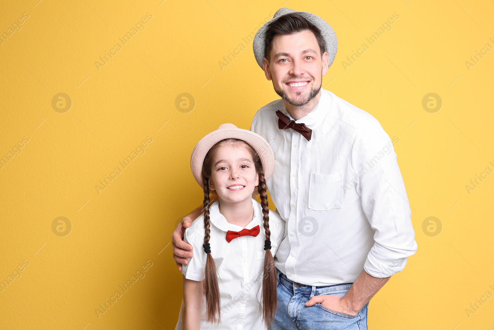 Photo of Dad and his daughter on color background. Father's day celebration